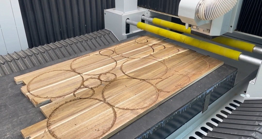 Different cup-lid diameters nested on an acacia glued panel.